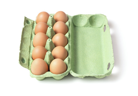set of fresh chicken eggs in papper tray isolated on white backgroundの写真素材