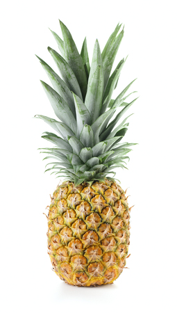 single ripe whole pineapple with green leaves isolated on white backgroundの写真素材