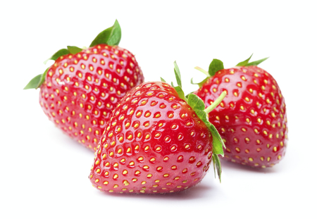 ripe red strawberry fruits isolated on white backgroundの写真素材