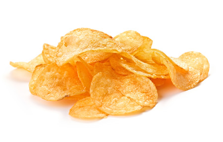 heap of potato chips isolated on white backgroundの写真素材