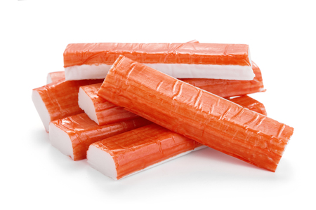heap of crab sticks isolated on white backgroundの写真素材
