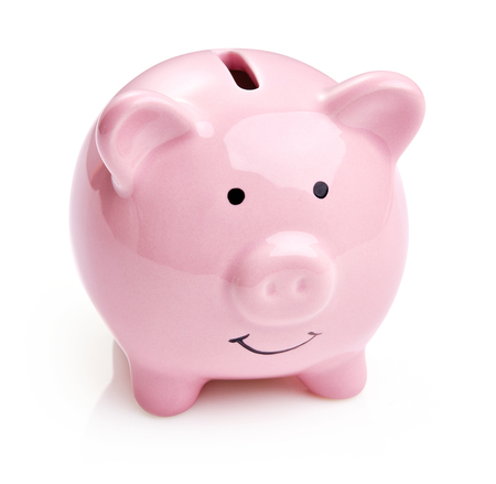 single ceramic pink piggy bank isolated on white backgroundの写真素材