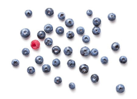 heap of fresh ripe blueberry and strawberry fruits with green leaves isolated on white backgroundの写真素材