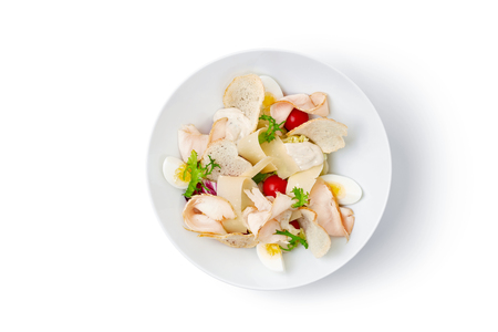 top view of white bowl with salad isolated on white backgroundの写真素材