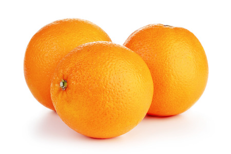 three ripe orange fruits isolated on white backgroundの写真素材