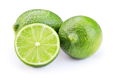 sliced ripe green lime fruit isolated on white backgroundの写真素材