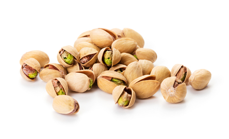 heap of ripe pistachios isolated on white backgroundの写真素材