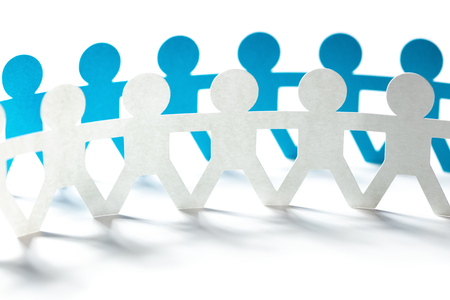 blue paper people holding hands in chainの写真素材