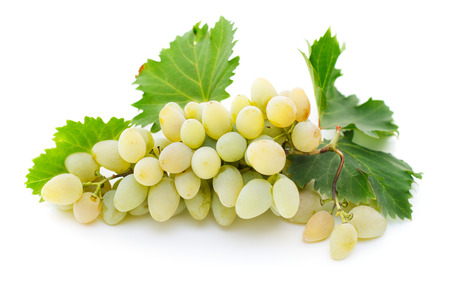 close-up view of bunch of ripe white grapes with leaves solated on white backgroundの写真素材