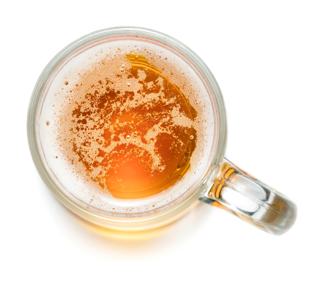 top view of glass of beer isolated on white backgroundの写真素材