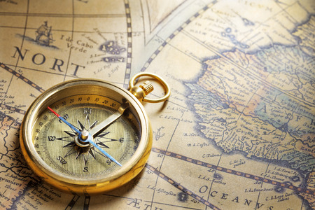 antique compass on antique map with big word indiaの写真素材