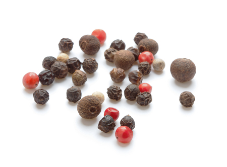 heap of peppercorns isolated on white backgroundの写真素材