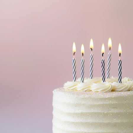 Birthday cake with candles, pastel background, celebration. AI Generatedの素材