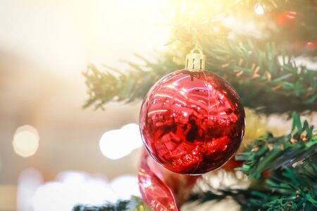 Blurry of Christmas and New Year's balls with beautiful decorations on the Christmas tree, soft light, beautiful background images and illustrations.の写真素材