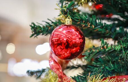 Blurry of Christmas and New Year's balls with beautiful decorations on the Christmas tree, soft light, beautiful background images and illustrations.の写真素材