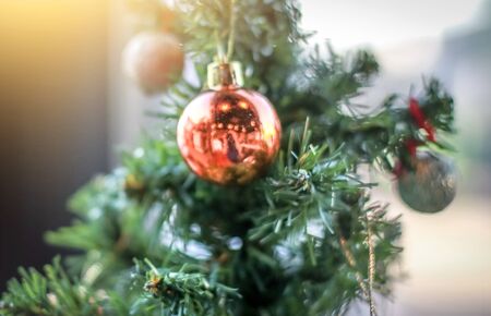 Blurry of Christmas and New Year's balls with beautiful decorations on the Christmas tree, soft light, beautiful background images and illustrations.の写真素材