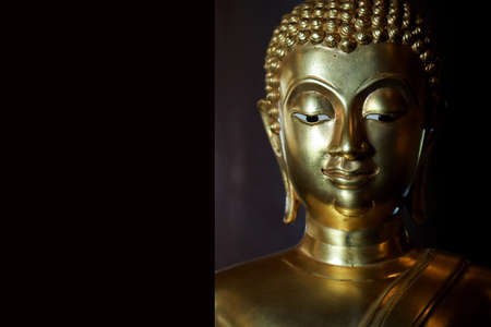 Selective focus  close-up shots of of the Buddha images with soft light and layout design for a beautiful religious background.の写真素材