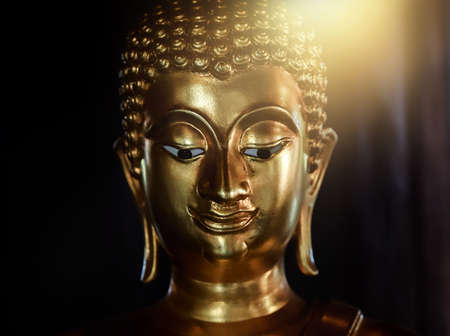Selective focus  close-up shots of of the Buddha images with soft light and layout design for a beautiful religious background.の写真素材