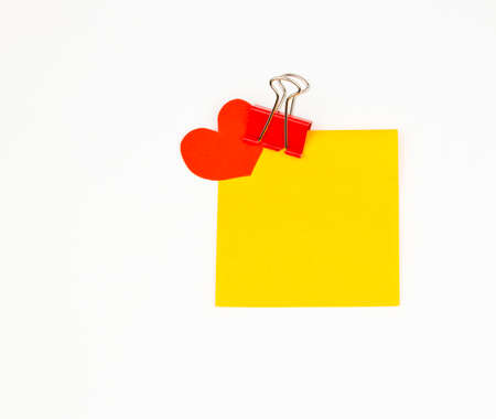 Business still-life of a sticker, heart, paperclipの写真素材