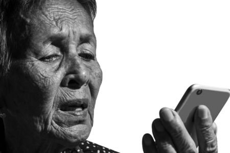 Senior woman playing  smartphoneの写真素材