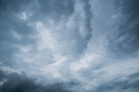 clouds with background,sunlight through very dark clouds background of dark storm clouds,black sky...