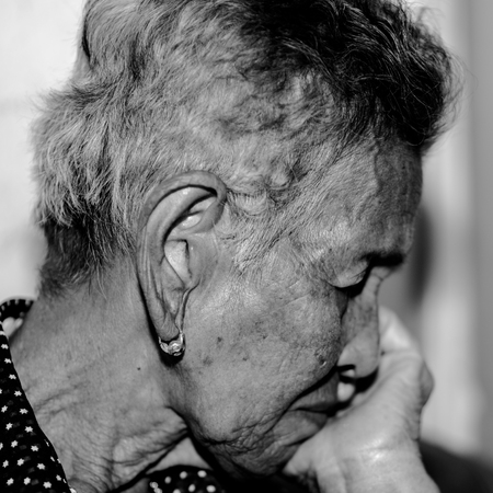 Lonely senior woman ,elderly, portrait sad depressed,emotion, feelings, thoughtful, senior, old womanの写真素材