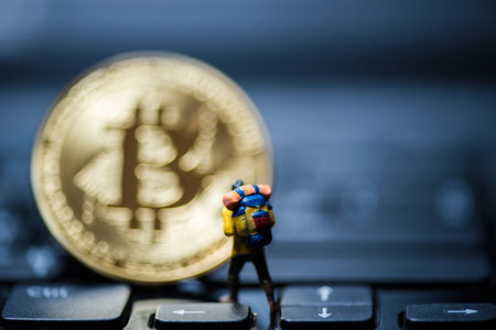 Golden Bitcoin money on computer.