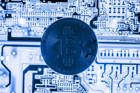 Abstract,Golden Bitcoin money on computer.の写真素材