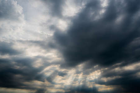 dark storm clouds,clouds with background,Dark clouds before a thunder-storm.の写真素材