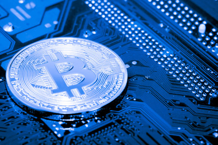 close up of Bitcoin money mining on graphic card,we see the technology of the mainboard,which is the...