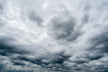 clouds with background,sunlight through very dark clouds background of dark storm clouds, black sky...