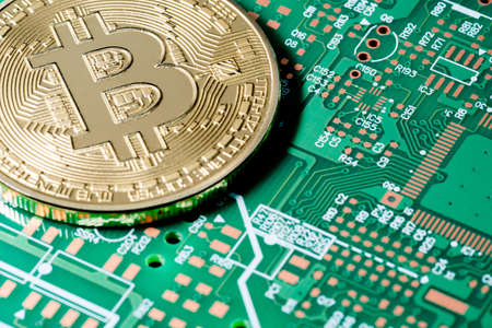 Golden Bitcoin money on computer.の写真素材