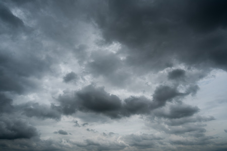 dark storm clouds with background,Dark clouds before a thunder-storm.の写真素材