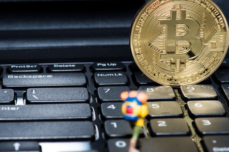 Golden Bitcoin money on computer.