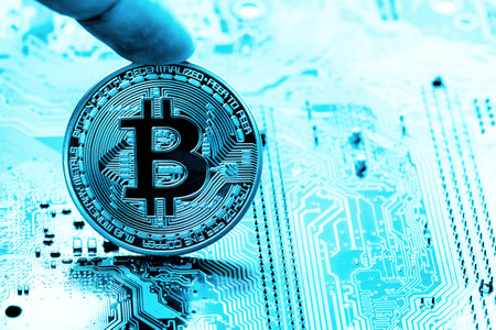 Golden Bitcoin money on computer.