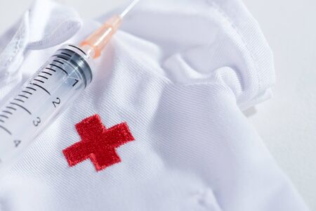 Red Cross hypodermic needle(injection needle) on white background.の写真素材