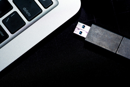 USB flash memory drive plugged into a computer laptop port.の写真素材