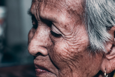 The old woman's felling lonely. ,she's senior woman in family and the elderly.の写真素材
