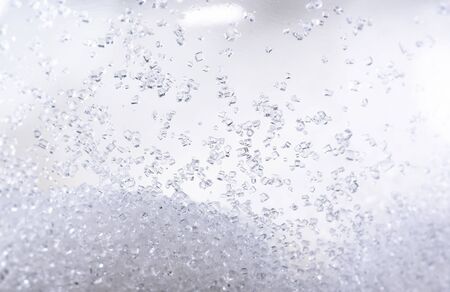 Close up of crystal sugar in Glass bottles on white background.の写真素材