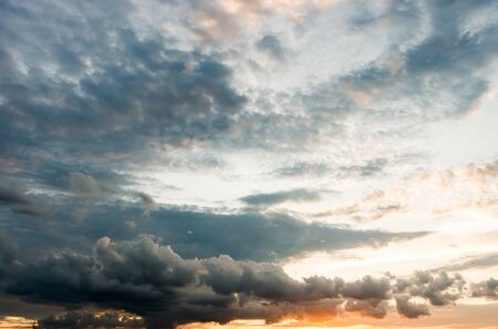 dark storm clouds with background,Dark clouds before a thunder-storm.の写真素材