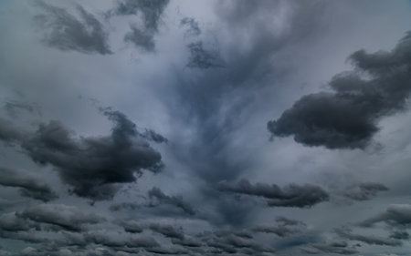 dark storm clouds with background,Dark clouds before a thunder-storm.の写真素材