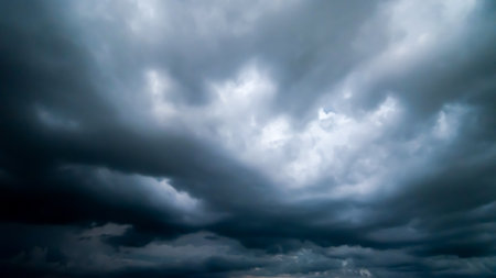 dark storm clouds with background,Dark clouds before a thunder-storm.の写真素材