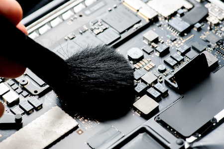 close up of Technician repairing electronic circuit board, repairing, upgrade and technology.の写真素材