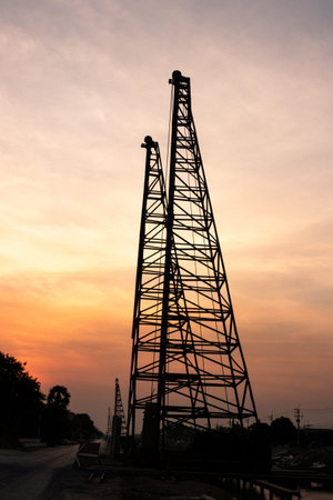 silhouette high voltage pole on sky sunset background.