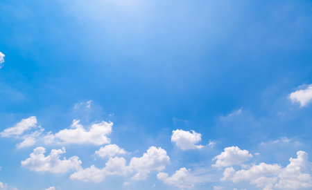 Panoramic view of clear blue sky and clouds, Blue sky background with tiny clouds. White fluffy clouds in the blue sky.の写真素材