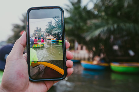 Tourists riding bamboo basket boats in Hoi An, vietnam (Cam Thanh water coconut village )の写真素材