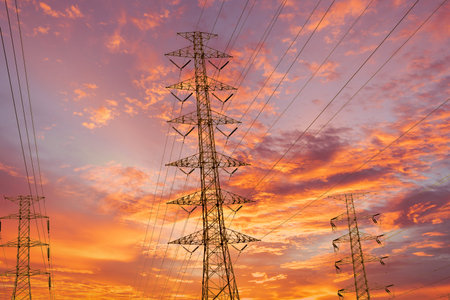 silhouette high voltage pole on sky sunset background.