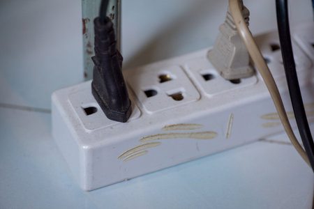 plugging or unplugging electrical wall outlet, save energy, environment protectionの写真素材