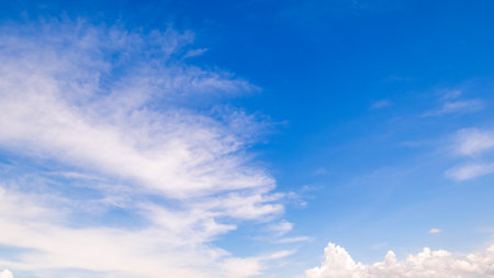 clear blue sky background,clouds with background, Blue sky background with tiny clouds. White fluffy clouds in the blue sky.の写真素材