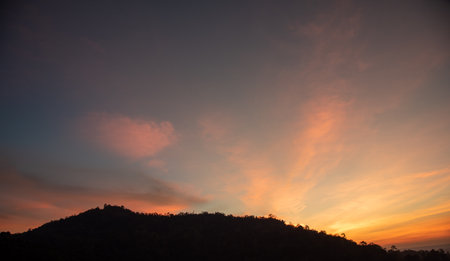 Panoramic view of sunset golden and blue sky nature background.
Colorful dramatic sky with cloud at sunset.Sky background.Sky with clouds at sunset.の写真素材